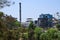 Stock photo of a factory located middle of Indian village or countryside surrounded by green trees in a sunny day at kolhapur city