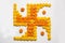 Stock photo of hindu auspicious symbol called Swastika made using marigold flower or zendu or genda phool, Flower rangoli in the s