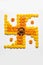 Stock photo of hindu auspicious symbol called Swastika or swastik made using marigold flower/zendu/genda phool & diwali diya / cla