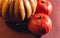 Stock photo pumpkin close-up, assorted pumpkins. Big and small size pumpkins and different colors, on a brown background