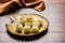 Stock Photo of Rasgulla or sponge Ras Gulla, It is made from ball shaped dumplings of chhena and semolina dough, cooked in light s