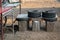 Stock photo of recycle old damage tyre and rusty steel container as sitting bench at Indian tea stall in Kolhapur city Maharashtra