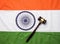 Stock photo showing Indian low and jurisdiction - Indian national flag or tricolour with wooden gavel showing concept of law in In