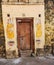 Stock photo of a vintage rusty Indian-style iron gate or door, painted in brown color, adorned with ancient traditional door