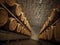 Stocked wine barrels across two sides of corridor of a wine cellar