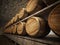 Stocked wine barrels across two sides of corridor of a wine cellar