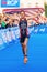 STOCKHOLM - AUG, 24: The winner Gwen Jorgensen running to the finish line with the USA flag in the Womens ITU World Triathlon