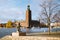 Stockholm city hall with Djurgarden ferry boat and Evert Taube statue, Sweden, Scandinavia