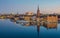 Stockholm Old Town reflected over frozen water at dawn.