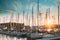Stockholm, Sweden. Jetty With Many Moored Yachts During Summer Sailing Regatta In Sunset Lights