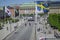 Stockholm, Sweden - June 15, 2019 Group of uniformed people marching on the street followed by two horsemen