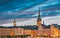 Stockholm, Sweden. Scenic View Of Skyline At Evening Night. Tower Of Storkyrkan - The Great Church Or Church Of St