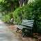 StockImage Park bench offers a tranquil spot next to a lush hedge