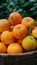 StockImage Pile of fresh organic oranges in brown basket, healthy fruit