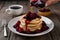 StockImage Warm pancake served with blackberry syrup captured in foodgraphy