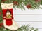 Stocking Befana and Christmas decorations on wooden white background