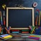StockPhoto Back to school concept stationery and writing board on black