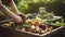 stockphoto, Person composting food waste in backyard compost bin garden. Person putting green waste into a compost bin