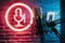 StockPhoto Studio podcast microphone on blurry neon background, broadcasting equipment photo