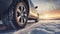 stockphoto, Winter tire. SUV car on snow road. Tires on snowy highway detail. close up view. Space for text.