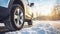 stockphoto, Winter tire. SUV car on snow road. Tires on snowy highway detail. close up view. Space for text.