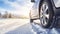 stockphoto, Winter tire. SUV car on snow road. Tires on snowy highway detail. close up view. Space for text