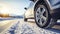 stockphoto, Winter tire. SUV car on snow road. Tires on snowy highway detail. close up view. Space for text.