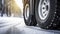 stockphoto, Winter tire. truck on snow road. Tires on snowy highway detail. close up view. Copy space.