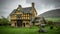 Stokesay castle gatehouse with yellow color and half-timbered detailing and view of garden on an overcast day.