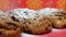 Stollen - German fruit cakes. Process of the dusting with the thick layer of the confectionersâ€™ sugar