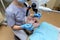 Stomatologist examining teeth of patient with help of professional dental microscope. Dentist preventing caries using restoration