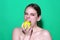 Stomatology concept. Woman with perfect smile holding apple on studio isolated background. Woman eat green apple