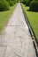 Stone alley in English formal garden