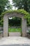 A stone arch entry, covered in a vine, leading to the sunken garden, at Rotary Botanic Gardens in Wisconsin