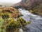 Stone arch footbridge over the West Okement River, Dartmoor National Park, Devon, UK