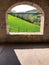 Stone arch like a window on the hills