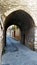 Stone arch on a narrow street