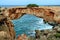 Stone arch over coastline