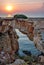 Stone arch over coastline