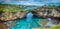 Stone arch over the sea. Broken beach, Nusa Penida , Indonesia.