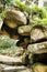 Stone arch with rocks in a Leafy garden in Sintra