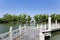 Stone arch and zigzag bridge in lake