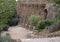 Stone architectural elements and gardens in Park Guell in Barcelona, Spain.