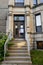 Stone architecture details, brown doors and strairs outdoors