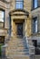 Stone architecture details, brownish door and strairs outdoors