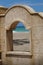 A stone archway on the beach in Ft.Lauderdale with the view of the ocean.