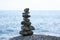 Stone and art on the beach.Balance of stones. The concept of meditation in the stones is stacked in pyramid.