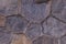 Stone background granite texture. multifaceted dark cobblestone wall elements background