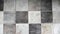 Stone background made of laminate. Square tiles in grey. Placed on the floor