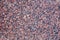 Stone Background of mottled red granite igneous rock